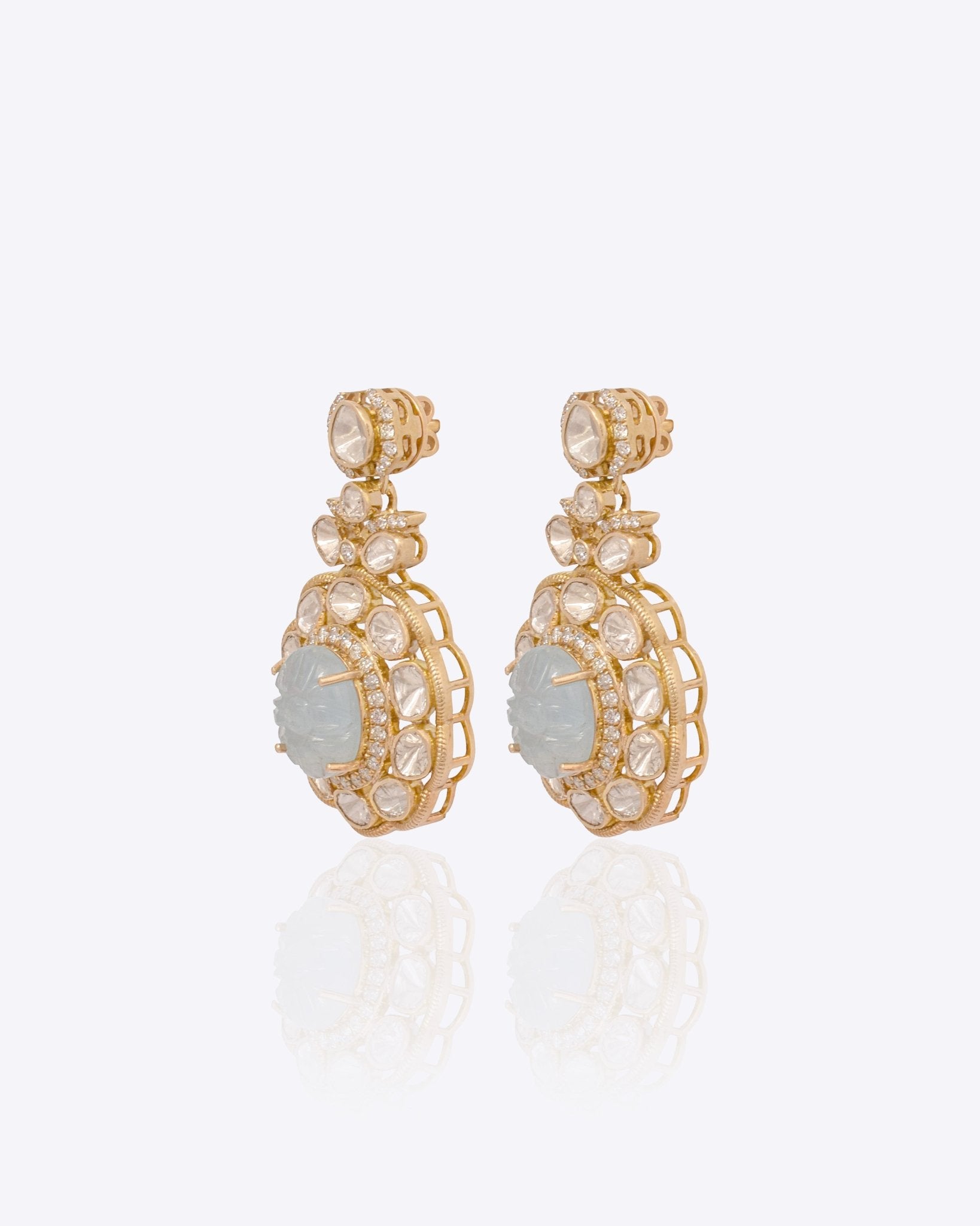 14K gold drop earrings with carved aquamarine centers and Polki diamond accents.