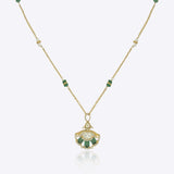 9k gold Tropical Plume necklace with fan pendant, elegant Polki center, and emerald arc detailing