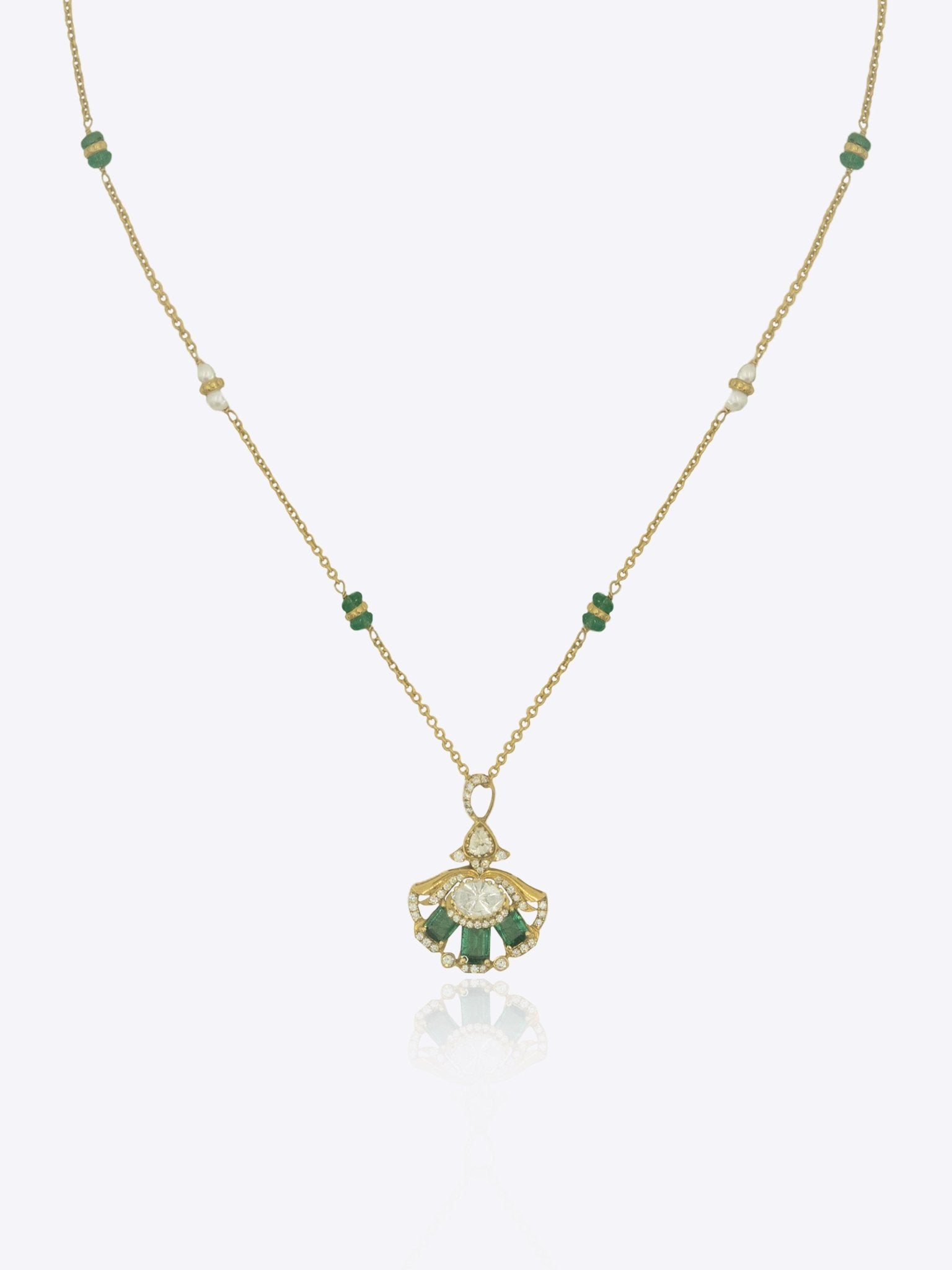 9k gold Tropical Plume necklace with fan pendant, elegant Polki center, and emerald arc detailing