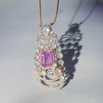Vintage Grace Pendant in 14k gold with radiant pink gemstone and Polki diamond framing.