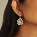 14K gold drop earrings with carved aquamarine petals and fine Polki diamond accents.