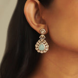 14K gold drop earrings with carved aquamarine petals and fine Polki diamond accents.