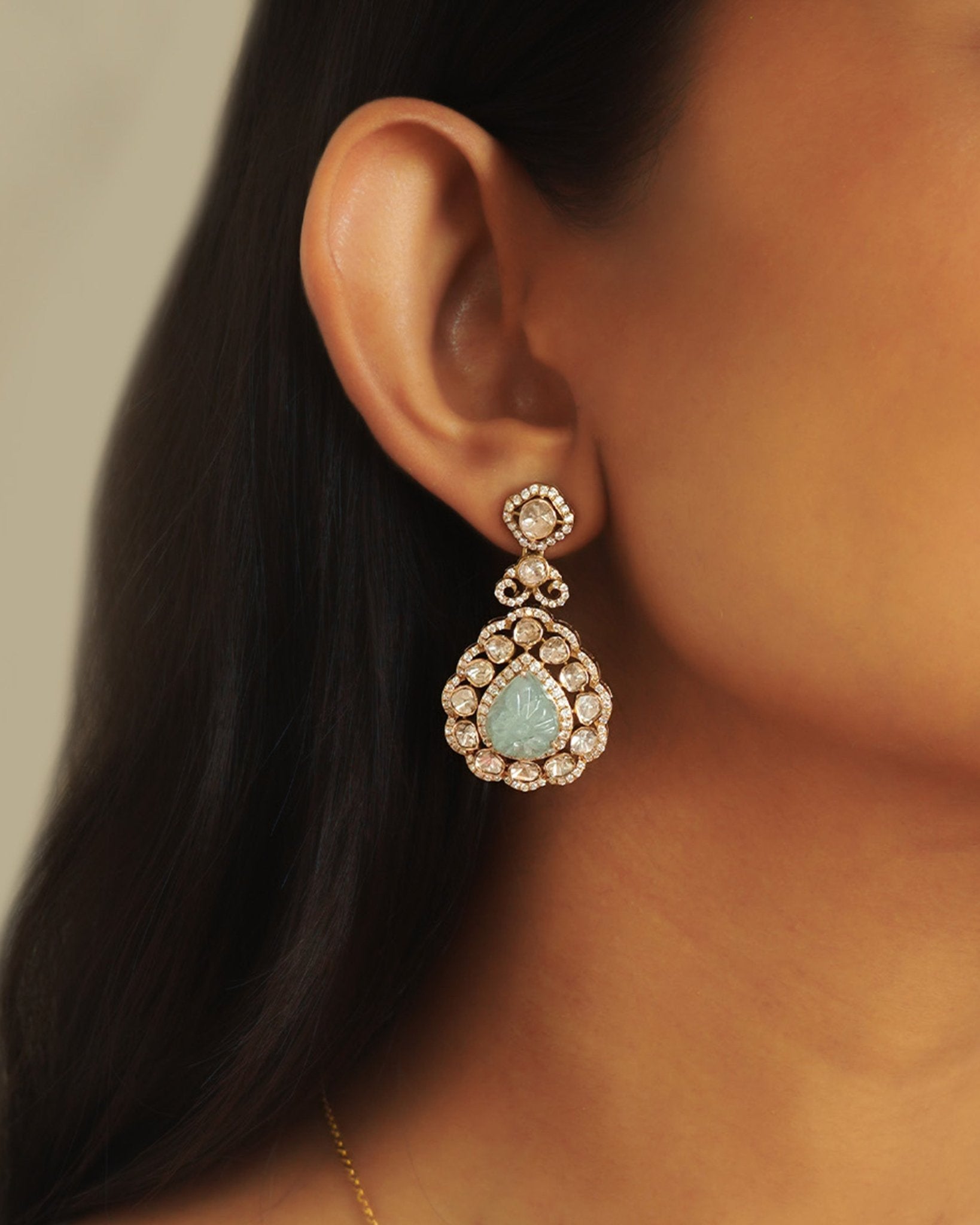 14K gold drop earrings with carved aquamarine petals and fine Polki diamond accents.