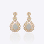 14K gold drop earrings with carved aquamarine petals and fine Polki diamond accents.