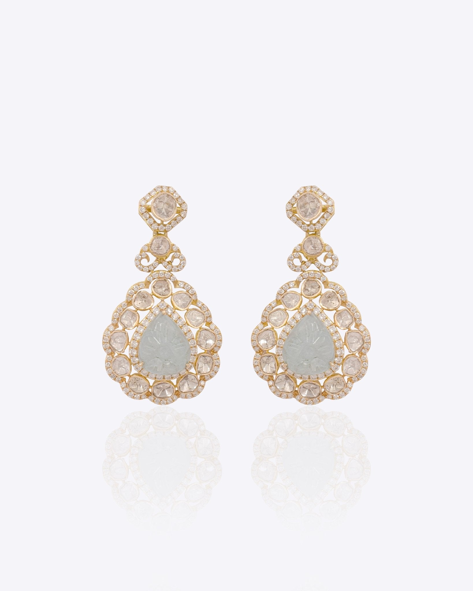 14K gold drop earrings with carved aquamarine petals and fine Polki diamond accents.