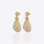 14K gold drop earrings with carved aquamarine petals and fine Polki diamond accents.