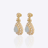 14K gold drop earrings with carved aquamarine petals and fine Polki diamond accents.