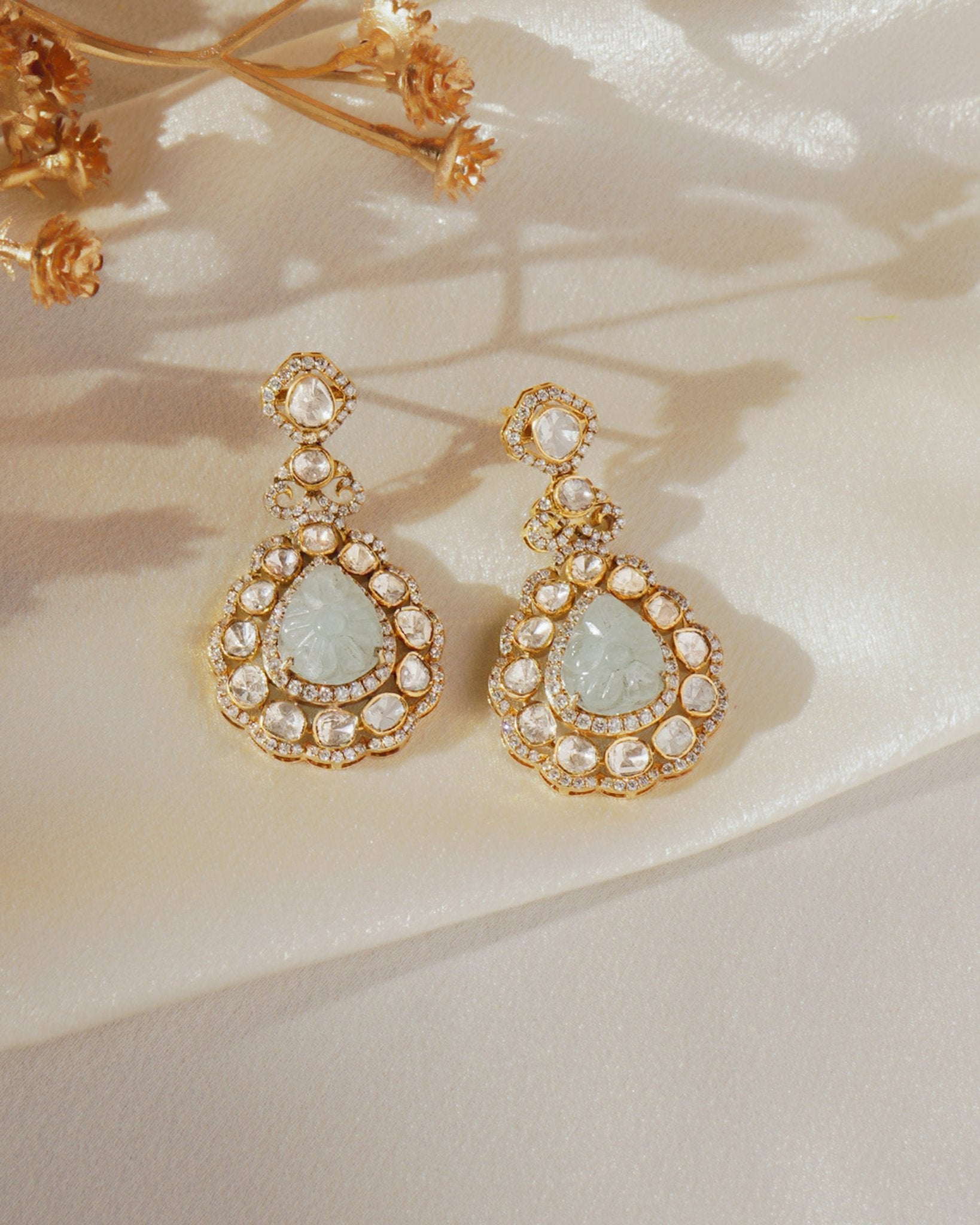 14K gold drop earrings with carved aquamarine petals and fine Polki diamond accents.