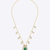 14K gold pendant with emerald centerpiece and diamond-studded bow