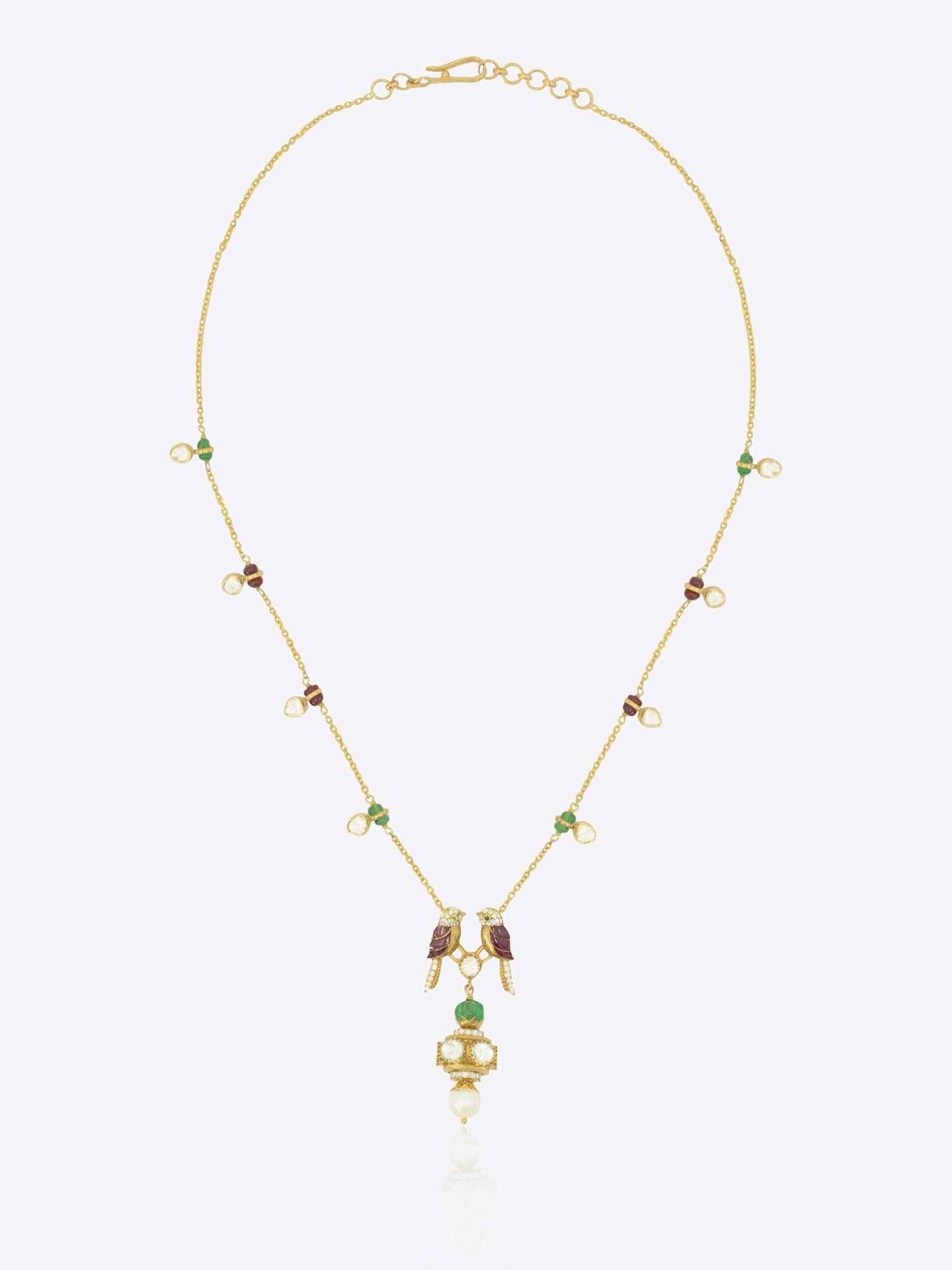 Twin bird Polki necklace in 14k gold with pink enamel wings and a bell charm.