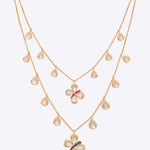 14k gold Papillon Dream Necklace with double-layered chain and Polki droplets.