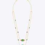 14K gold necklace with emerald-green gemstones and ruby accents