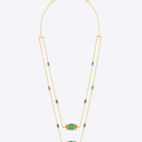 14K gold necklace with emerald-green gemstones and ruby accents