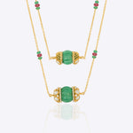 14K gold necklace with emerald-green gemstones and ruby accents