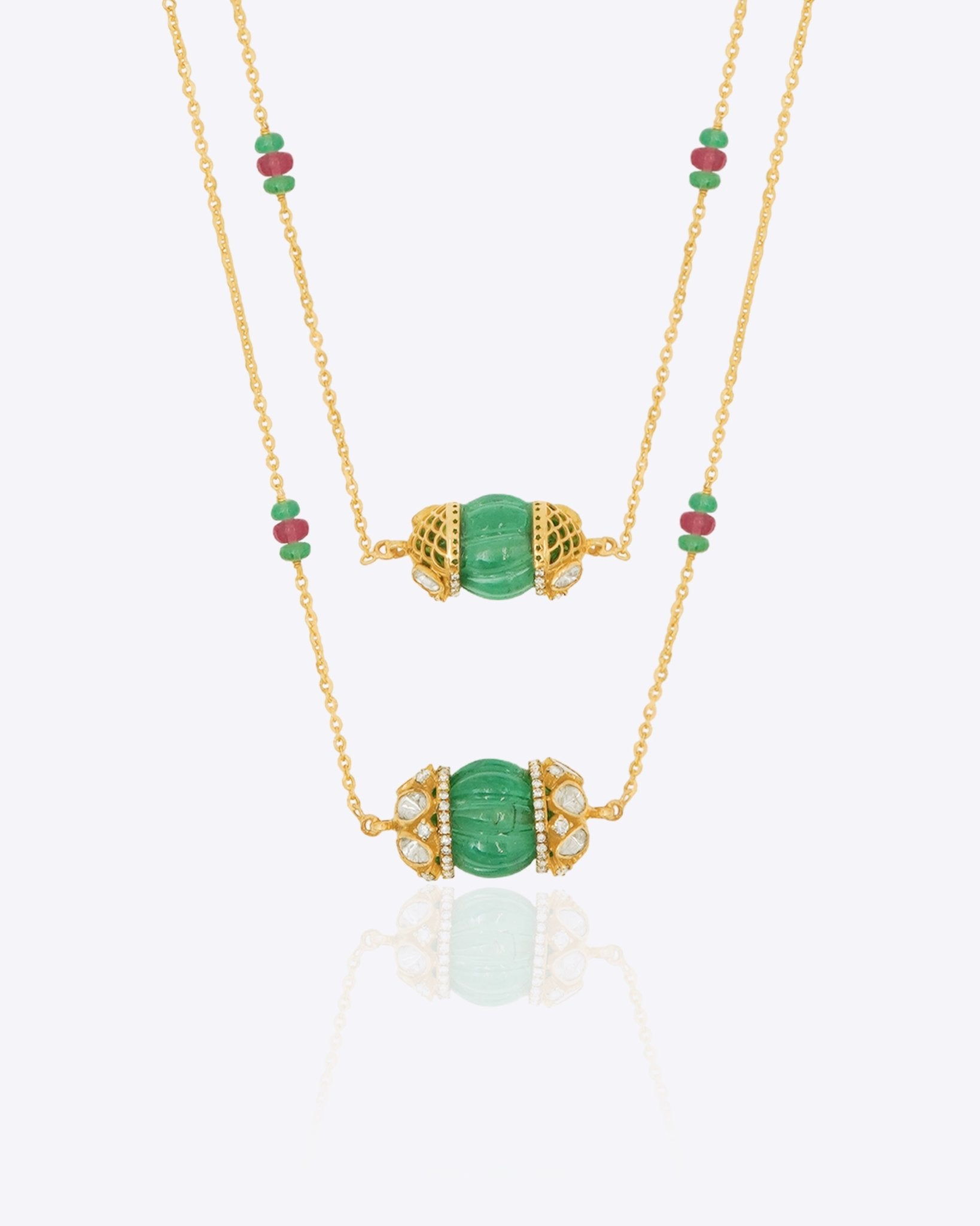 14K gold necklace with emerald-green gemstones and ruby accents