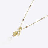 14K gold peacock-inspired pendant featuring luminous Polki accents with delicate moonlit brilliance.