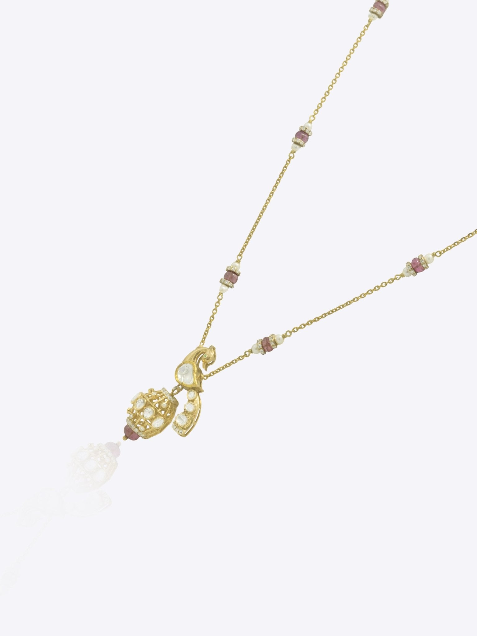 14K gold peacock-inspired pendant featuring luminous Polki accents with delicate moonlit brilliance.