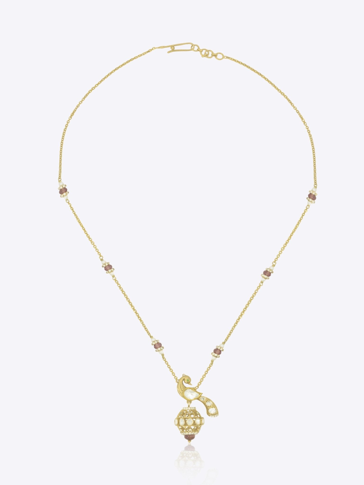 14K gold peacock-inspired pendant featuring luminous Polki accents with delicate moonlit brilliance.