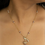 14K gold peacock-inspired pendant featuring luminous Polki accents with delicate moonlit brilliance.
