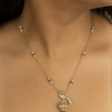 14K gold peacock-inspired pendant featuring luminous Polki accents with delicate moonlit brilliance.
