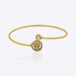 14K gold Opulent Glow bangle with Polki and diamond accents.
