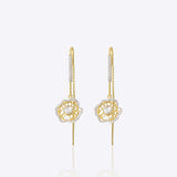 9k gold linear thread earrings with floral Polki accents and elegant detailing