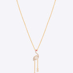 Serene Flamingo Necklace in 14K gold with a Polki flamingo motif and ruby accent