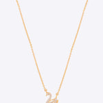 Swancrest Pendant in 14K gold with a sleek crest silhouette and diamond accents.