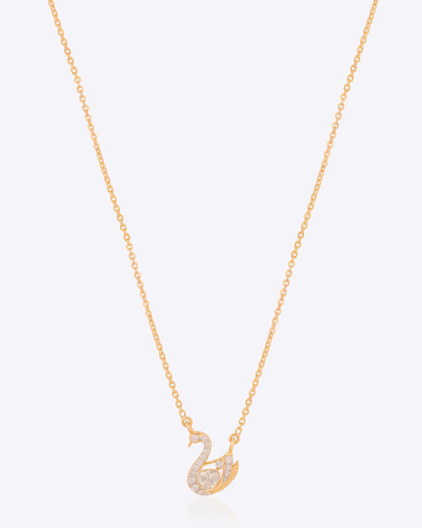 Swancrest Pendant in 14K gold with a sleek crest silhouette and diamond accents.