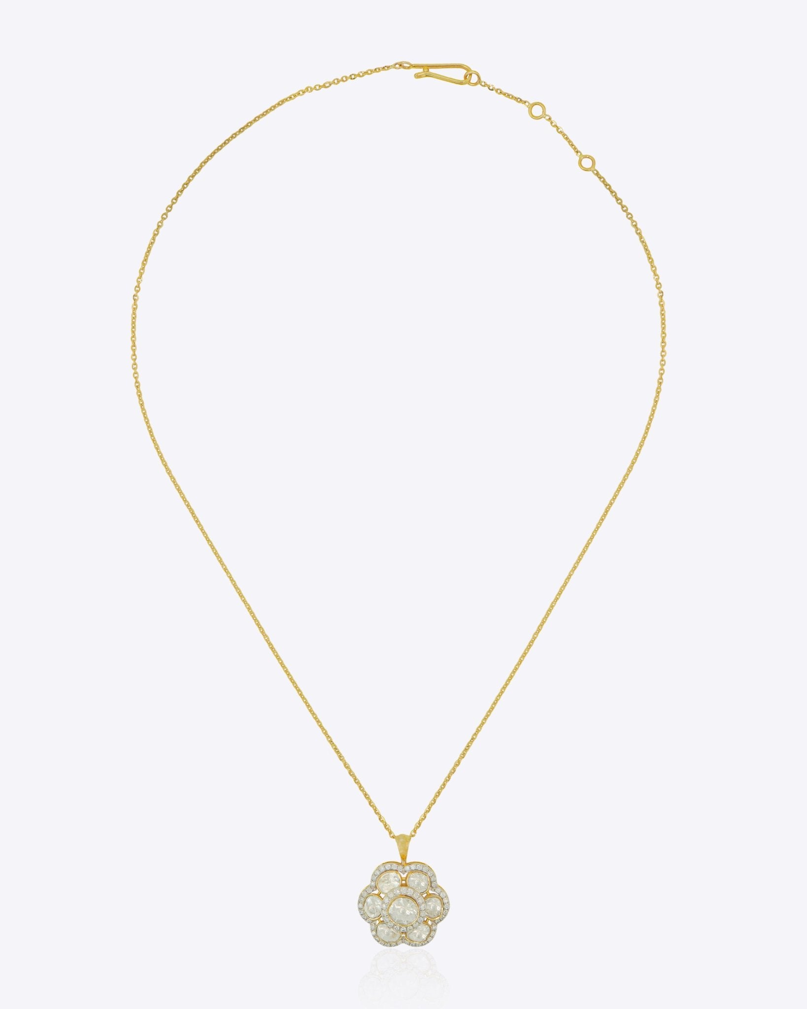 14K gold sculptural bloom pendant with a soft floral silhouette.