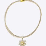 9k gold artistic necklace with starburst centerpiece and twisted detailing with minimal polki design