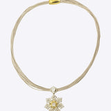 9k gold artistic necklace with starburst centerpiece and twisted detailing with minimal polki design