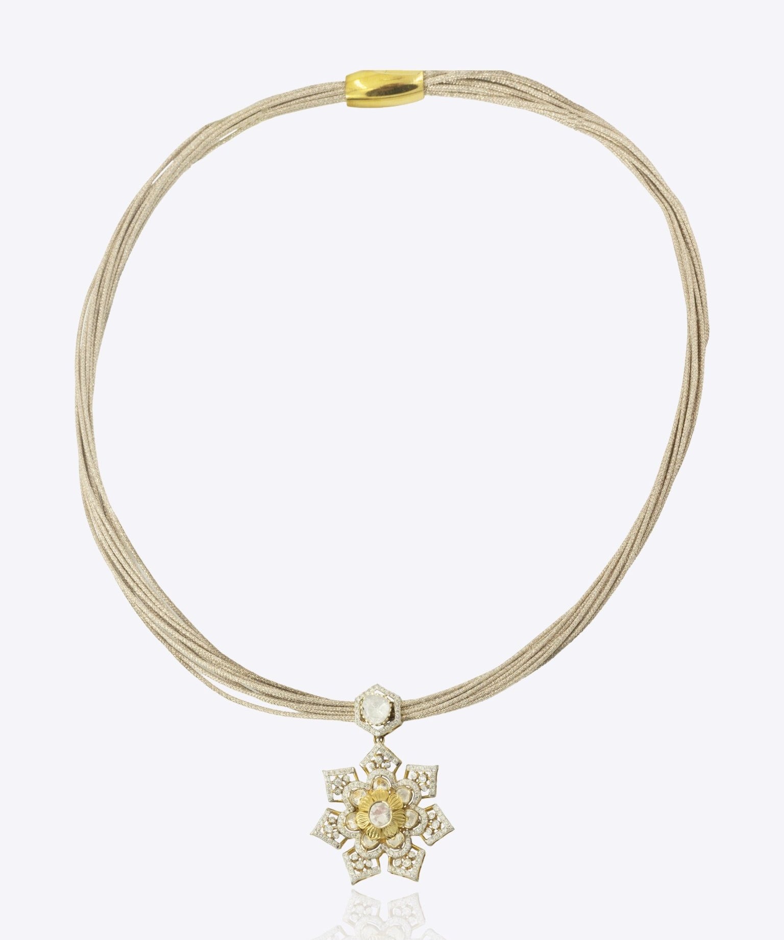 9k gold artistic necklace with starburst centerpiece and twisted detailing with minimal polki design