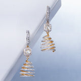 14k gold spiral earrings with Polki diamonds in a sculptural helix design.