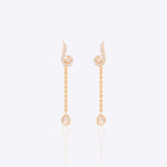 Twirl & Drop detachable earrings in 14K gold with diamond-studded swirl motif.