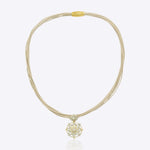 9k gold elegant thread necklace with floral centerpiece and emerald Polki design