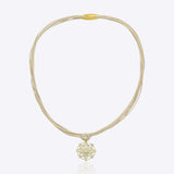 9k gold elegant thread necklace with floral centerpiece and emerald Polki design