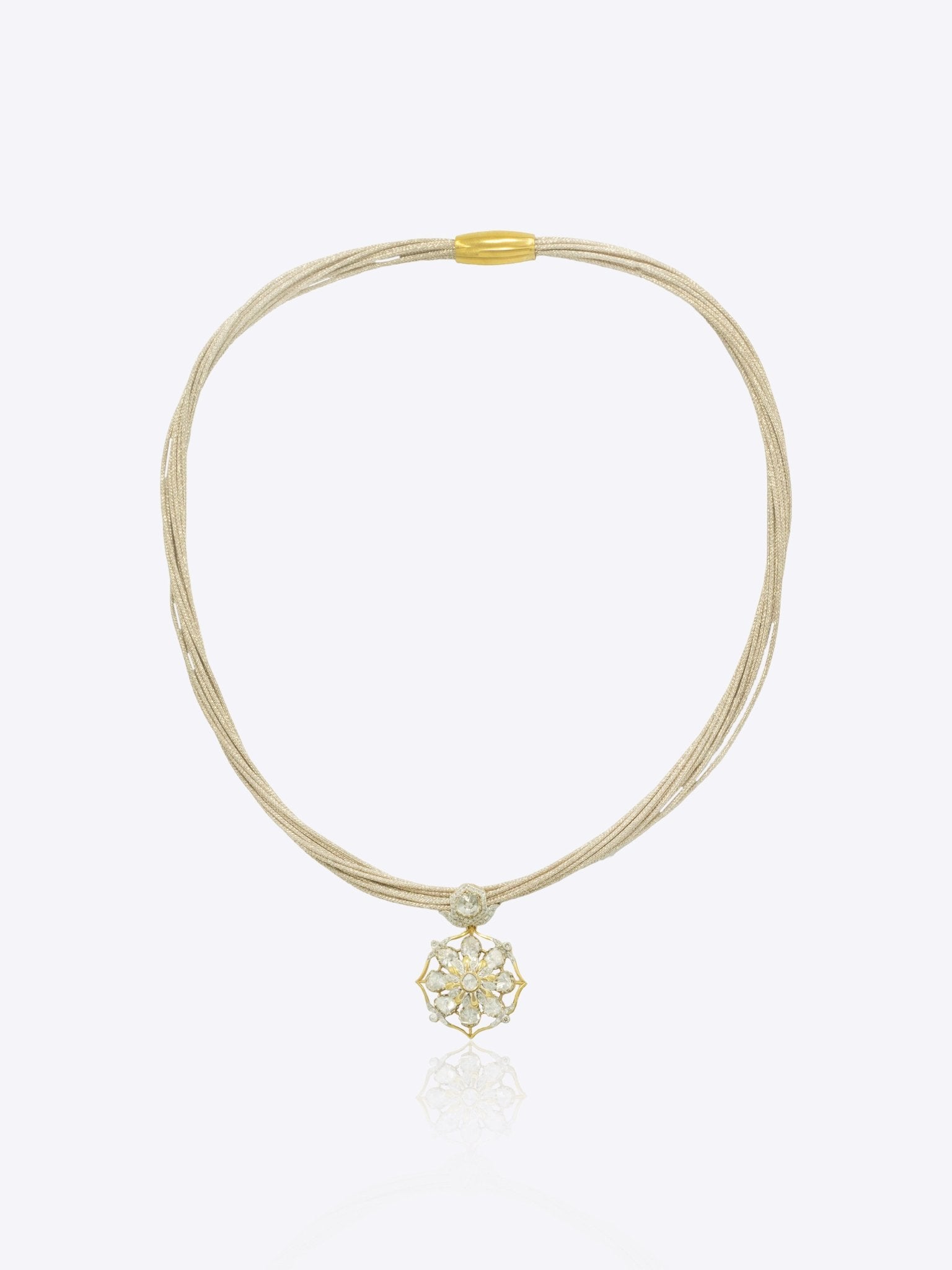 9k gold elegant thread necklace with floral centerpiece and emerald Polki design