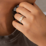 14K gold ring with an interwoven knot design set with Polki diamonds.