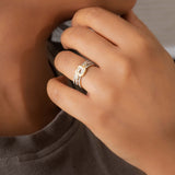 14K gold ring with an interwoven knot design set with Polki diamonds.
