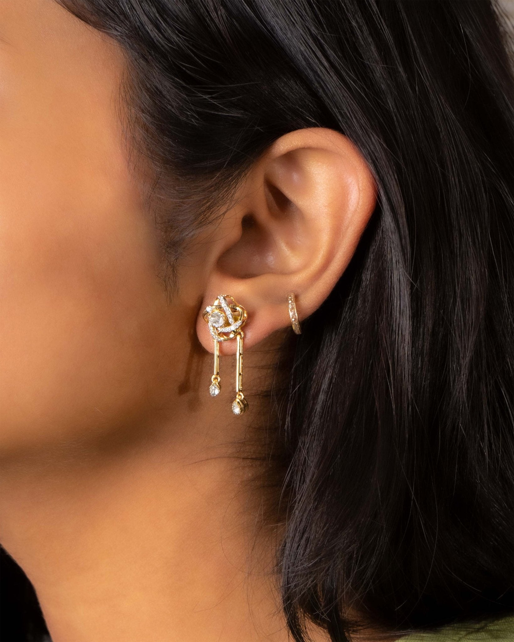 14K gold drop earrings with pear-shaped stones and knot motif