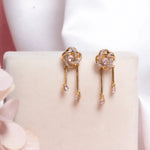 14K gold drop earrings with pear-shaped stones and knot motif