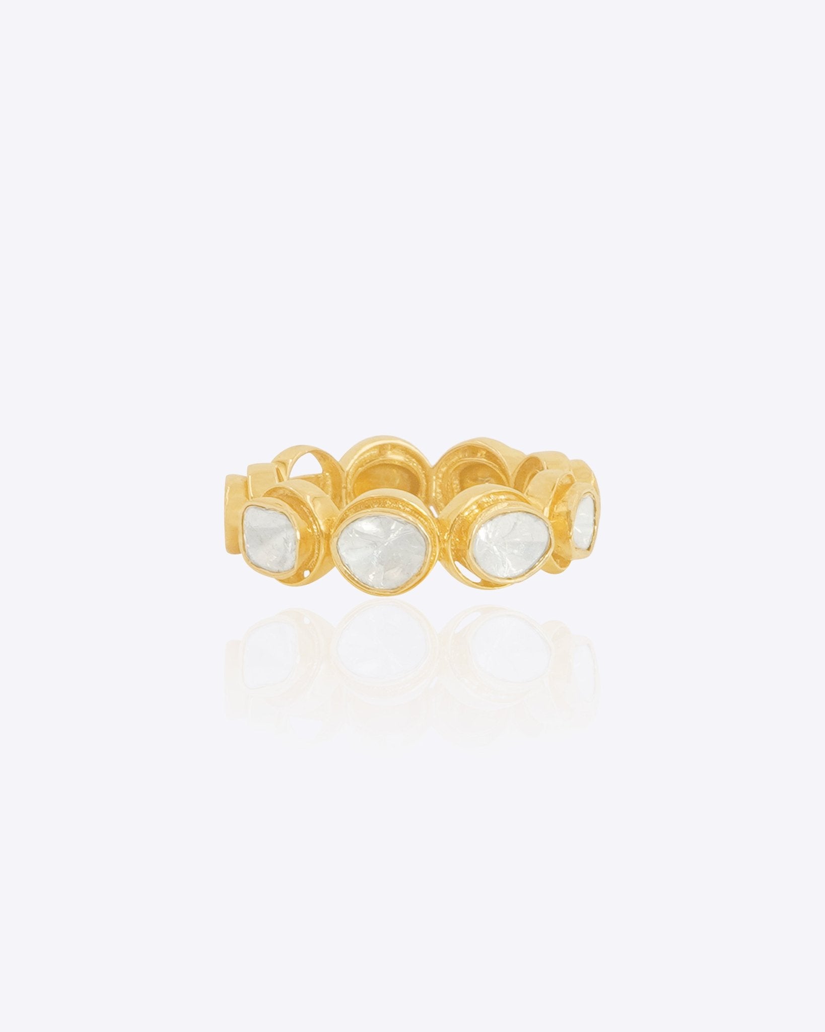 14K gold ring with a graceful arc design and bezel-set Polki diamonds