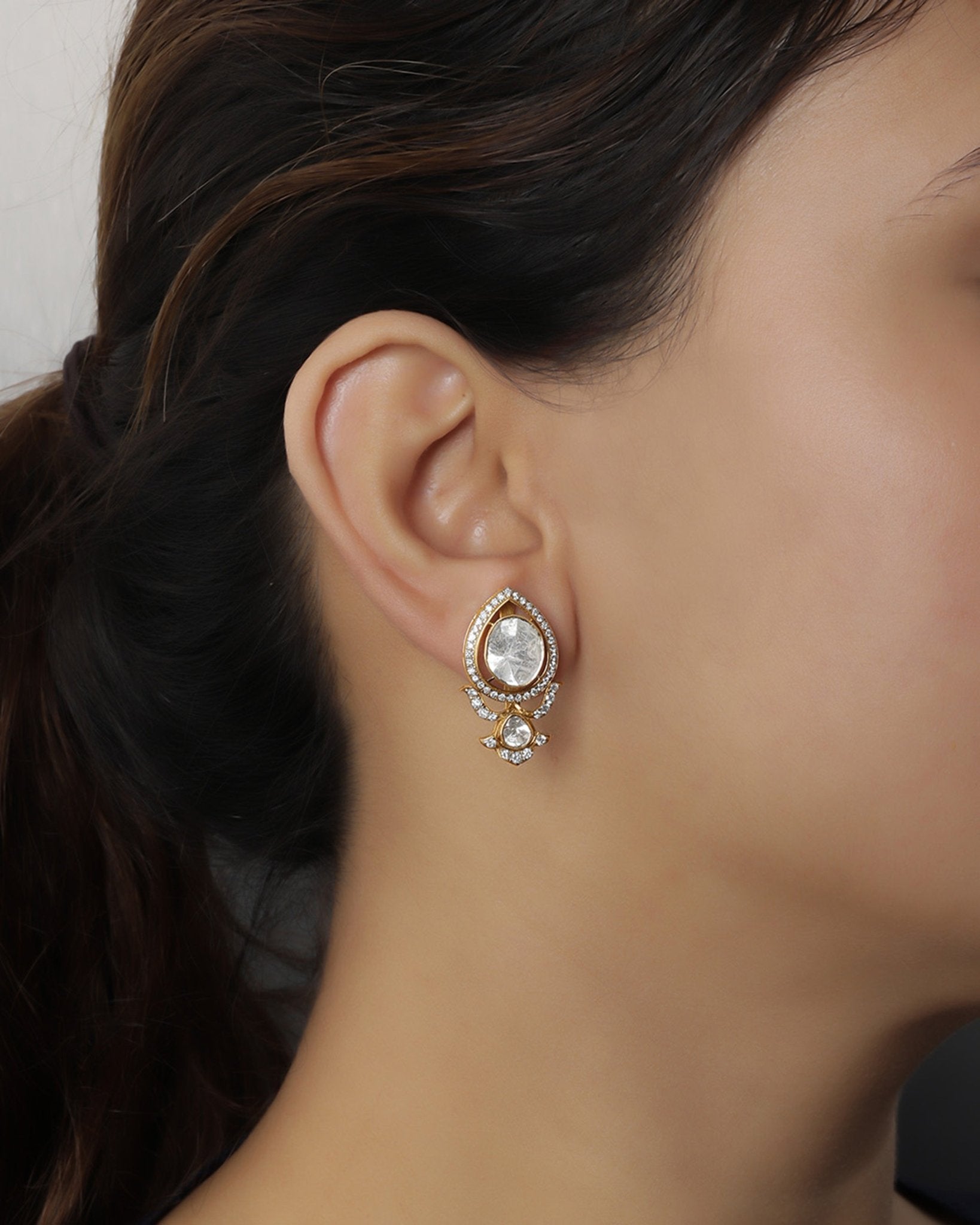 14K gold earrings with Polki and diamond oval layering for festive sparkle.