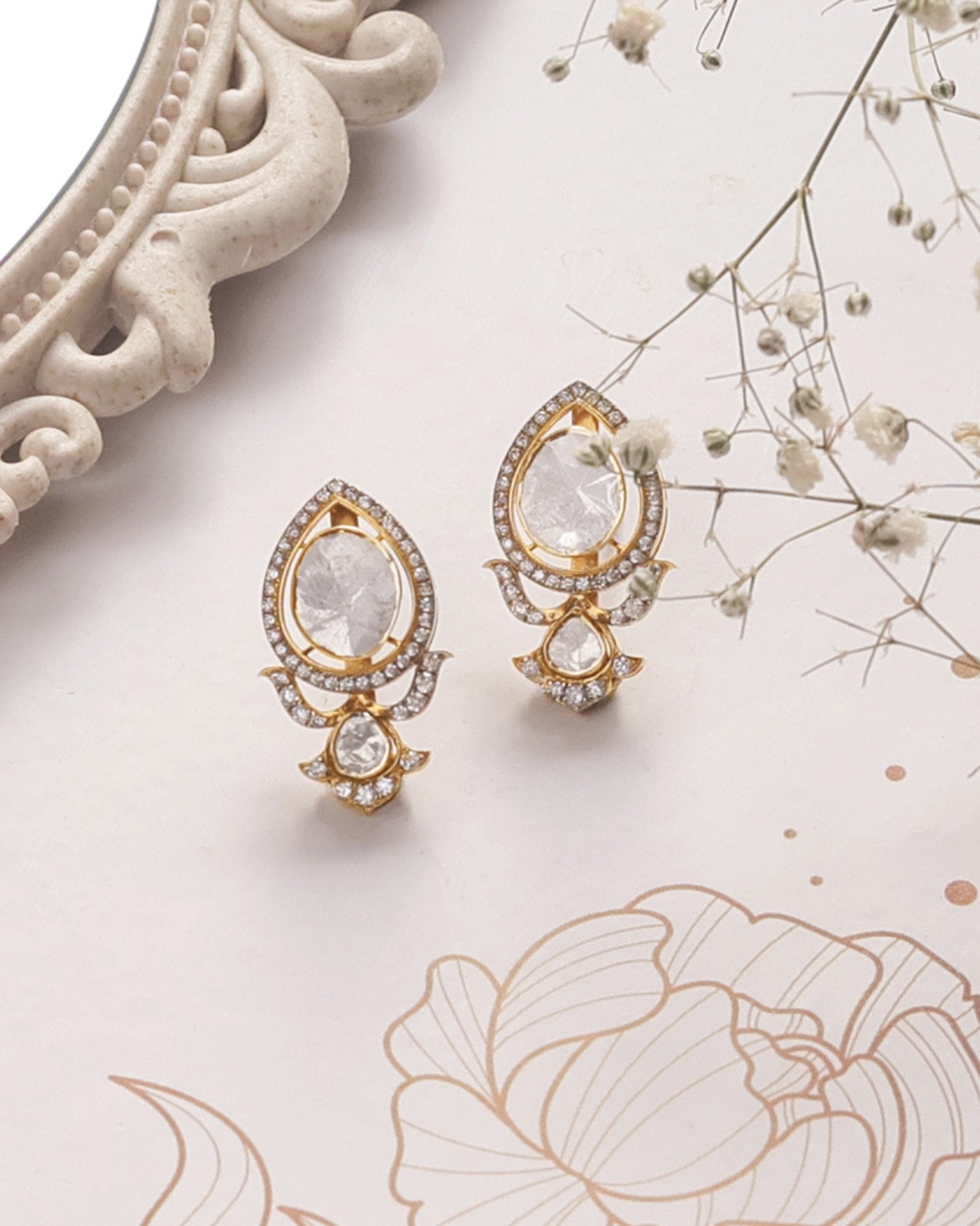 14K gold earrings with Polki and diamond oval layering for festive sparkle.