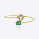 Delicate 9K gold bracelet with floral Polki centerpiece, diamond accents, and emerald toned detailing