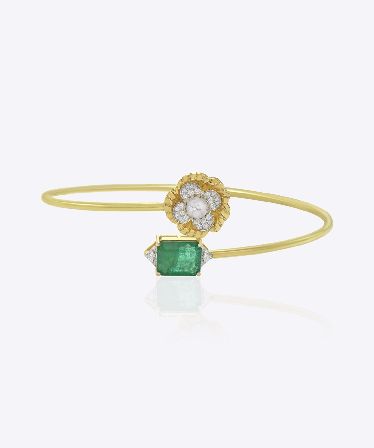 Delicate 9K gold bracelet with floral Polki centerpiece, diamond accents, and emerald toned detailing