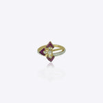 9k gold artistic ring with prism pink stones and central Polki design