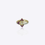 9k gold artistic ring with prism pink stones and central Polki design
