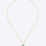 Oval emerald pendant in warm gold with a minimal, refined design